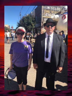 Evie-men-in-black-pose-mothman-festival.png