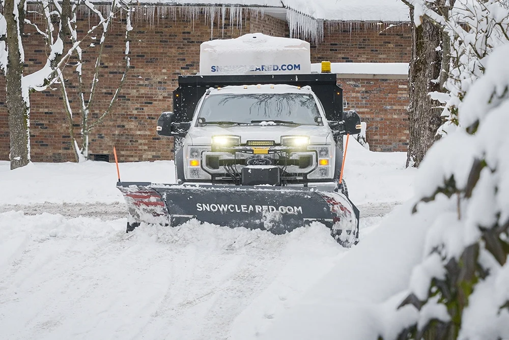 Snowcleared truck removing snow from the road