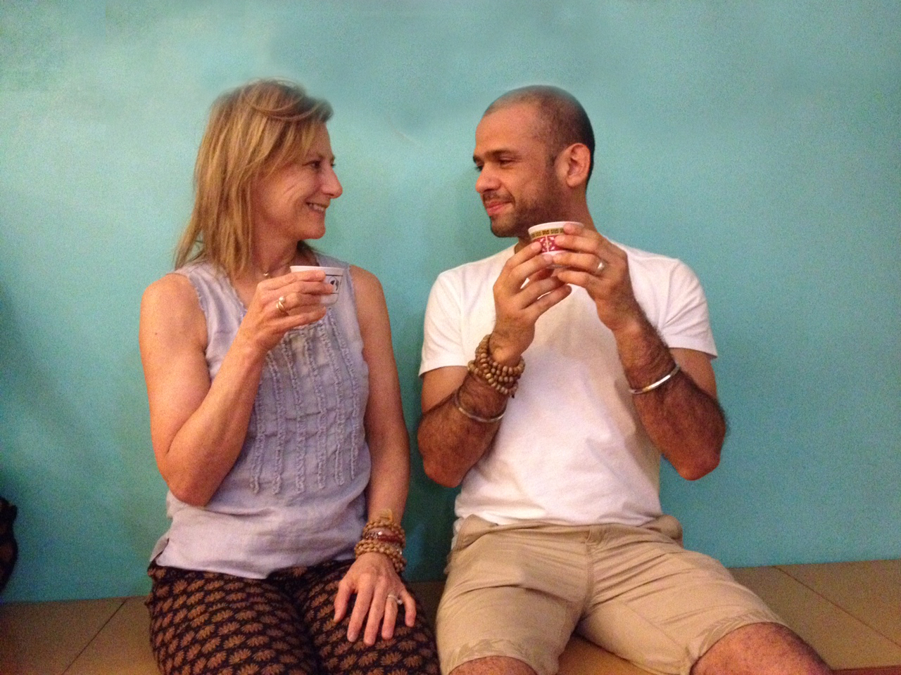A common sight after a Kundalini Yoga class: students enjoying Yogi Tea and a chat.