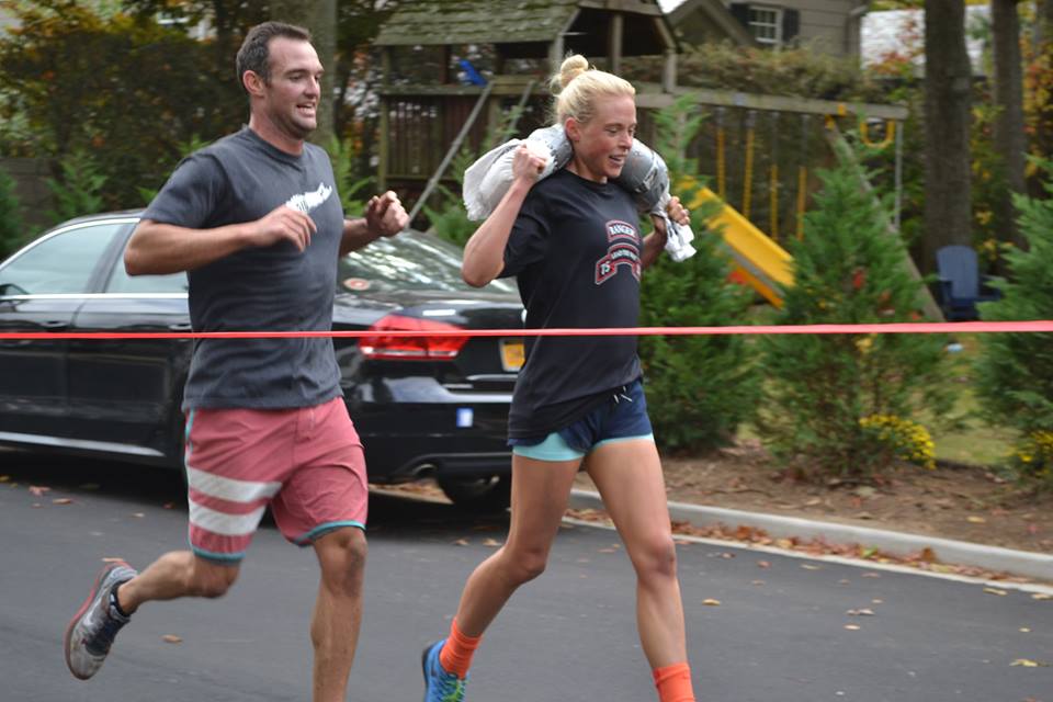 Jeff and I crossing the "finish line" as the first place team! This is how we ran with the sandbags on our shoulders.
