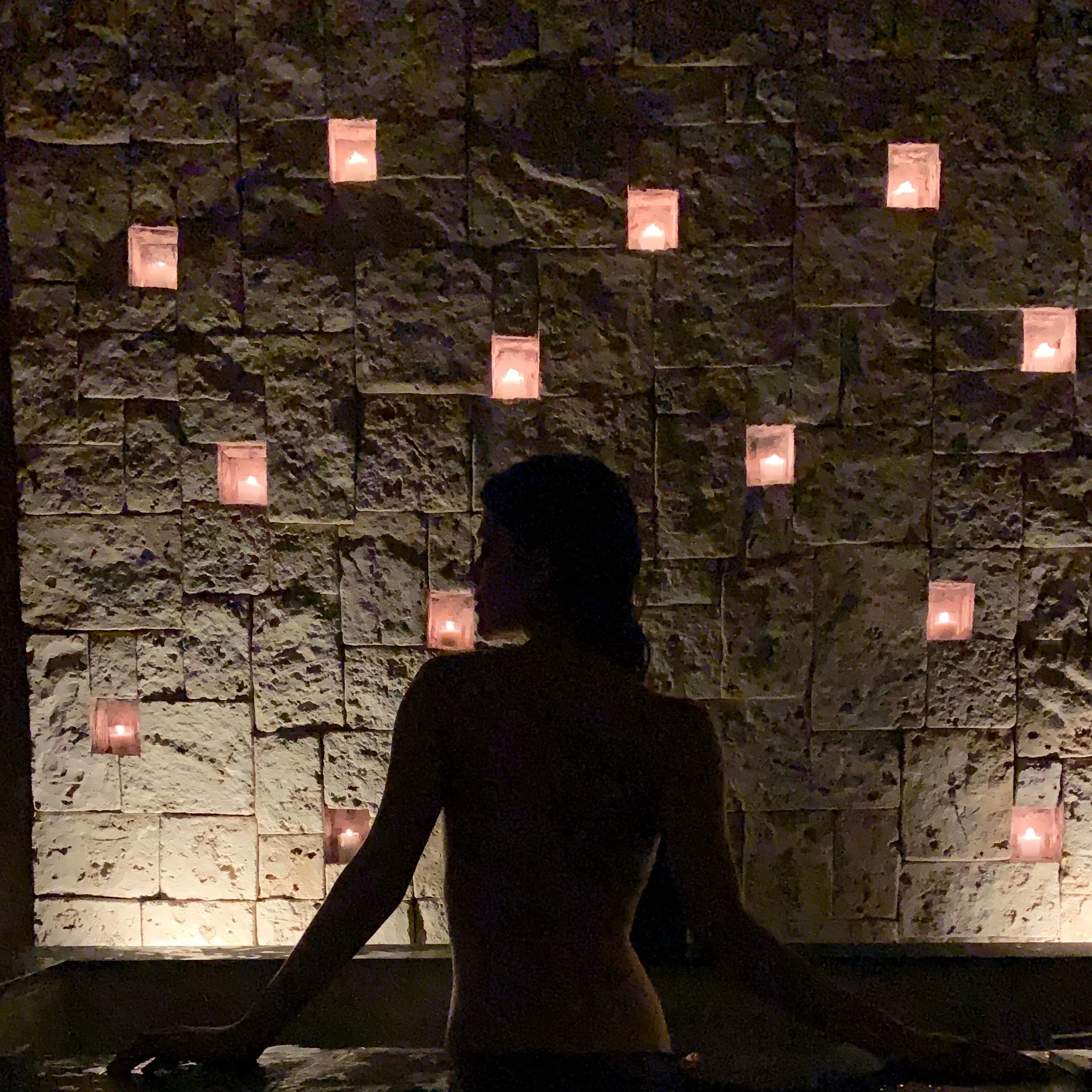 Taking a romantic outdoor candle lit bath with champagne !