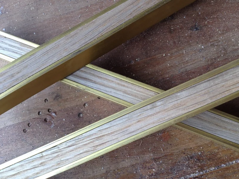 Brass and oak hanging rail detail
