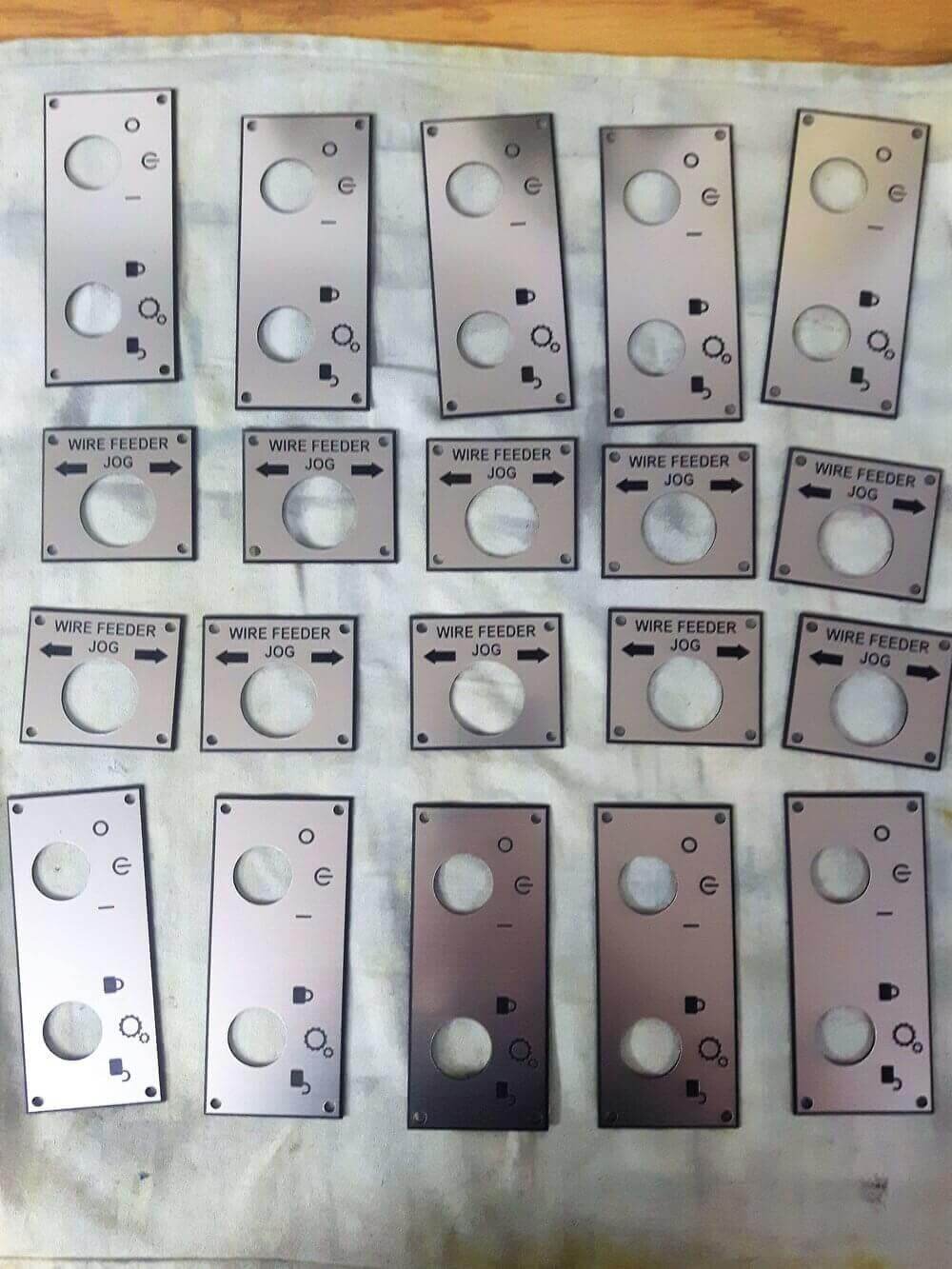 Control panel button plates