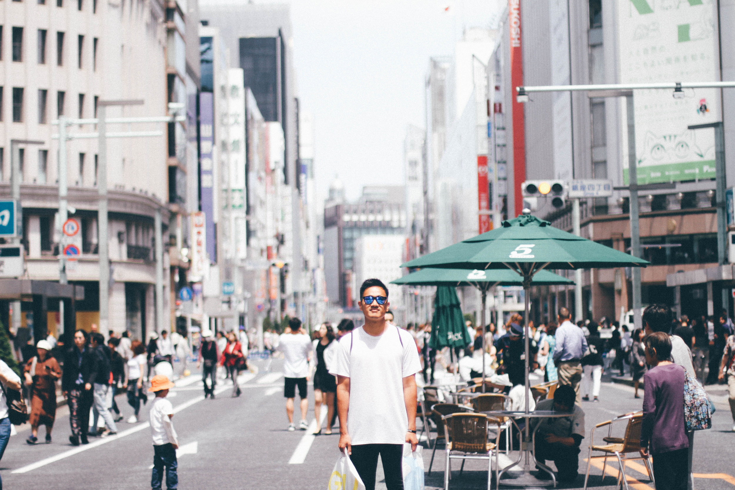 GINZA ANT GINZA, JAPAN My brother in law Anthony, "Ant", came to Japan in May with his friend Jose. We spent a short time in Tokyo together and I snapped this shot of him in Ginza, when they close down the street and let people walk around freely. When Ant, Jose, and Jose's fiance Kazue left my apartment they prayed for me and I cried. I remember hugging them and just being so thankful for their kindness and how they flooded my tiny apartment with the presence of God. I love my brother-in-law and was thankful for our short but sweet time together.