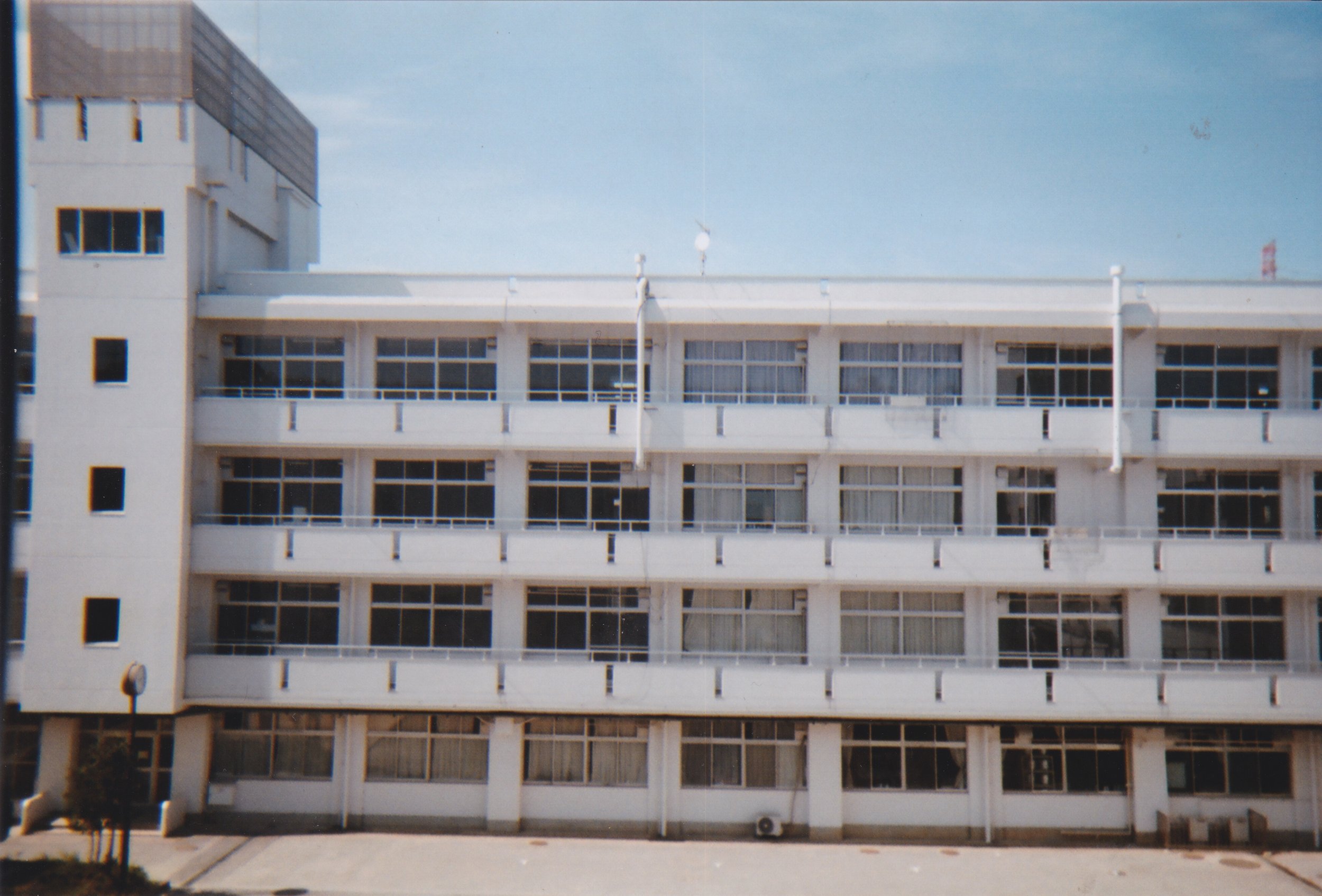 Ichikashi walls // This is the view from the inner courtyard of school. The school is one big rectangle. Four stories tall, no elevators and identical looking hallways. It took me at least a year to get a handle on where I was walking and how to get to certain places since every staircase looks exactly the same. I found myself always looking out the windows to the courtyard to gain perspective and remember where I was in relation to the center of school. As simple as this building in this photo may look…it hold an endless array of memories for me.