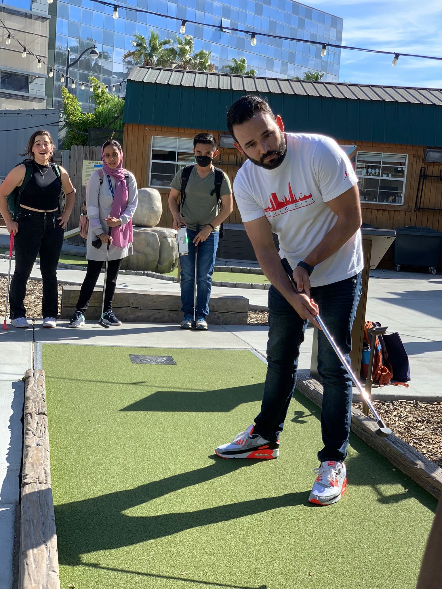  Daniel watching his golf ball, hoping it’s a hole in one. Summer 2022 