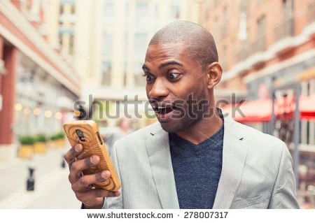 stock-photo-young-man-using-smart-phone-businessman-holding-mobile-smartphone-using-app-texting-sms-message-278007317.jpg