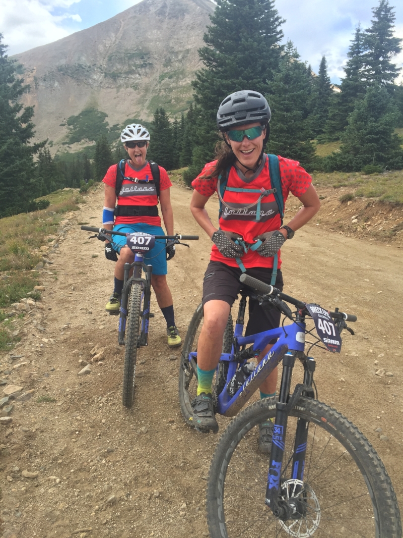 Uri + her partner, smiling through BreckEpic with grit and grace.