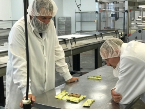 Jeff Kenyon, Skrach Labs Director of Operations & Ian MacGregor, Skratch Labs CEO checking out one of the first Chocolate Chips & Almonds Anytime Energy Bars.
