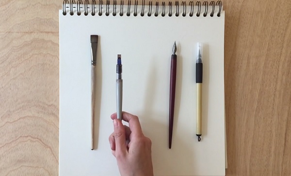 Designer Martina Flor displays the basic tools of calligraphy: translation tools with a broad or chiseled nib, and expansion tools with pointed nibs 