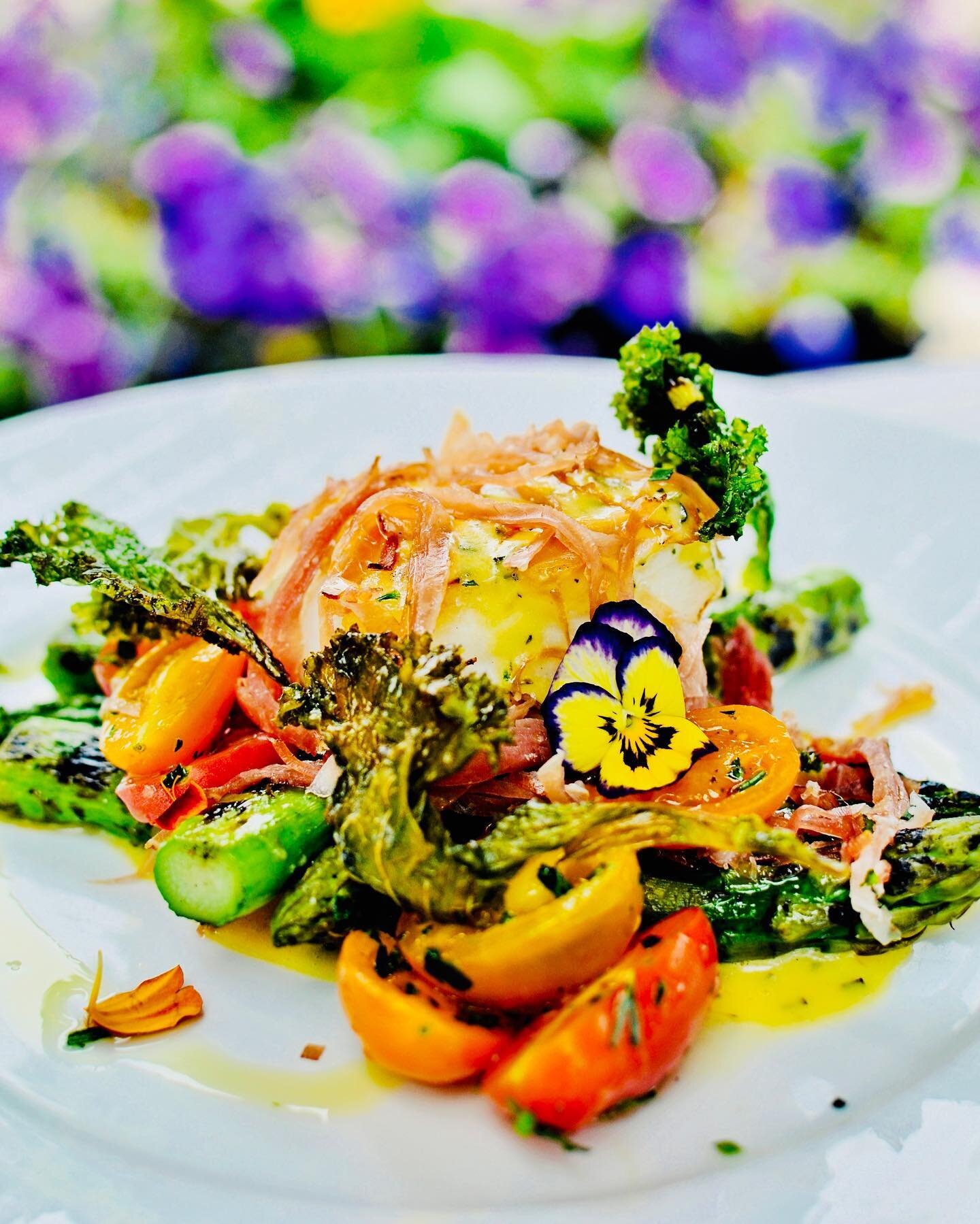 Roasted Halibut with roasted kale, asparagus and shallots, flanked with late summer heirloom tomatoes. Flaky tender fish with fresh vegetables and a tangy shallot lemon Dijon vinaigrette. Light and lovely late summer dish perfect for lunch or dinner.