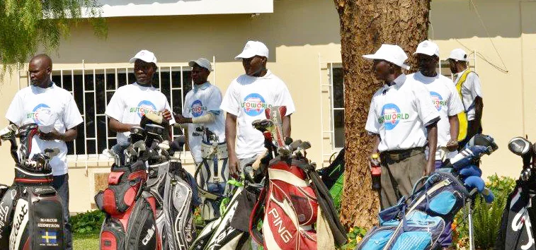 The caddies gather for the event in their Autoworld t-shirts and caps