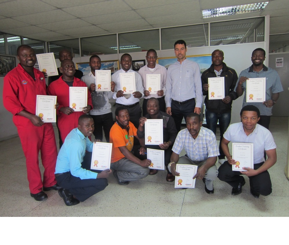 The 12 certificate-holders proudly show of their certificates, with Glenn Findlay, Autoworld Director, and Mr Phiri of Holts.