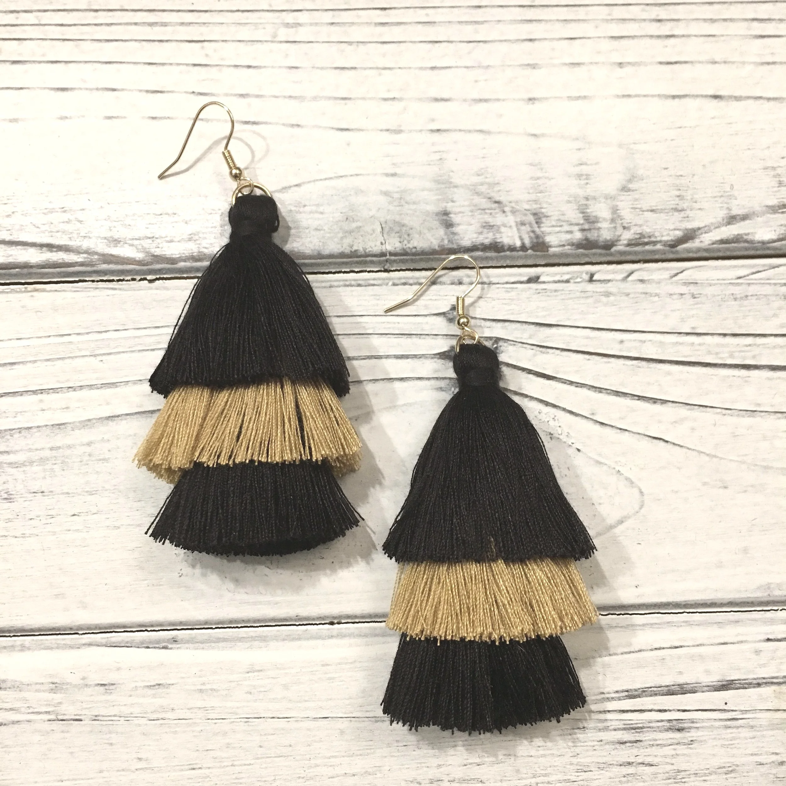 black and gold tassel earrings