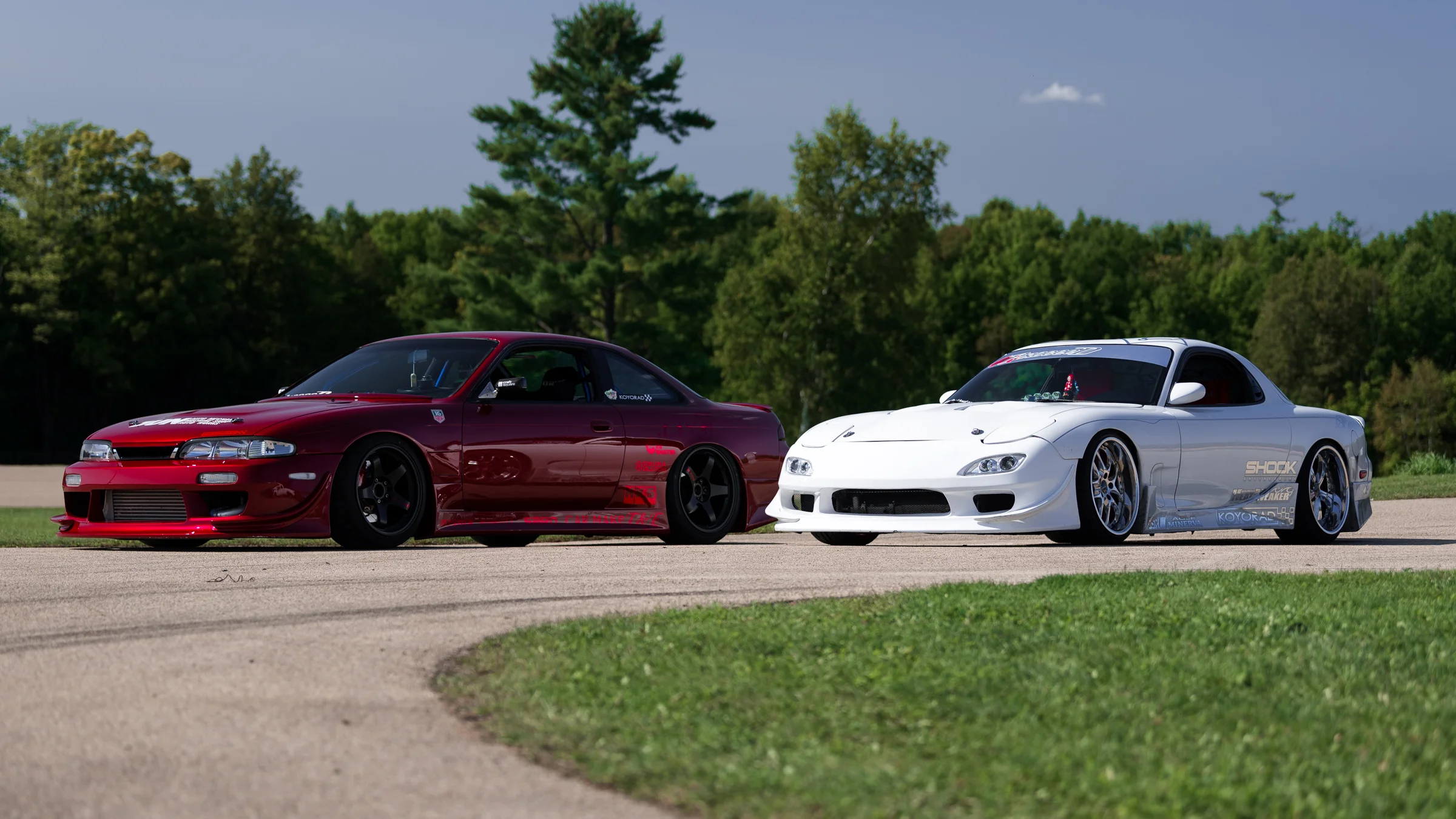 Proceed's Josh (S14) and Ilia (FD) sitting on the track.