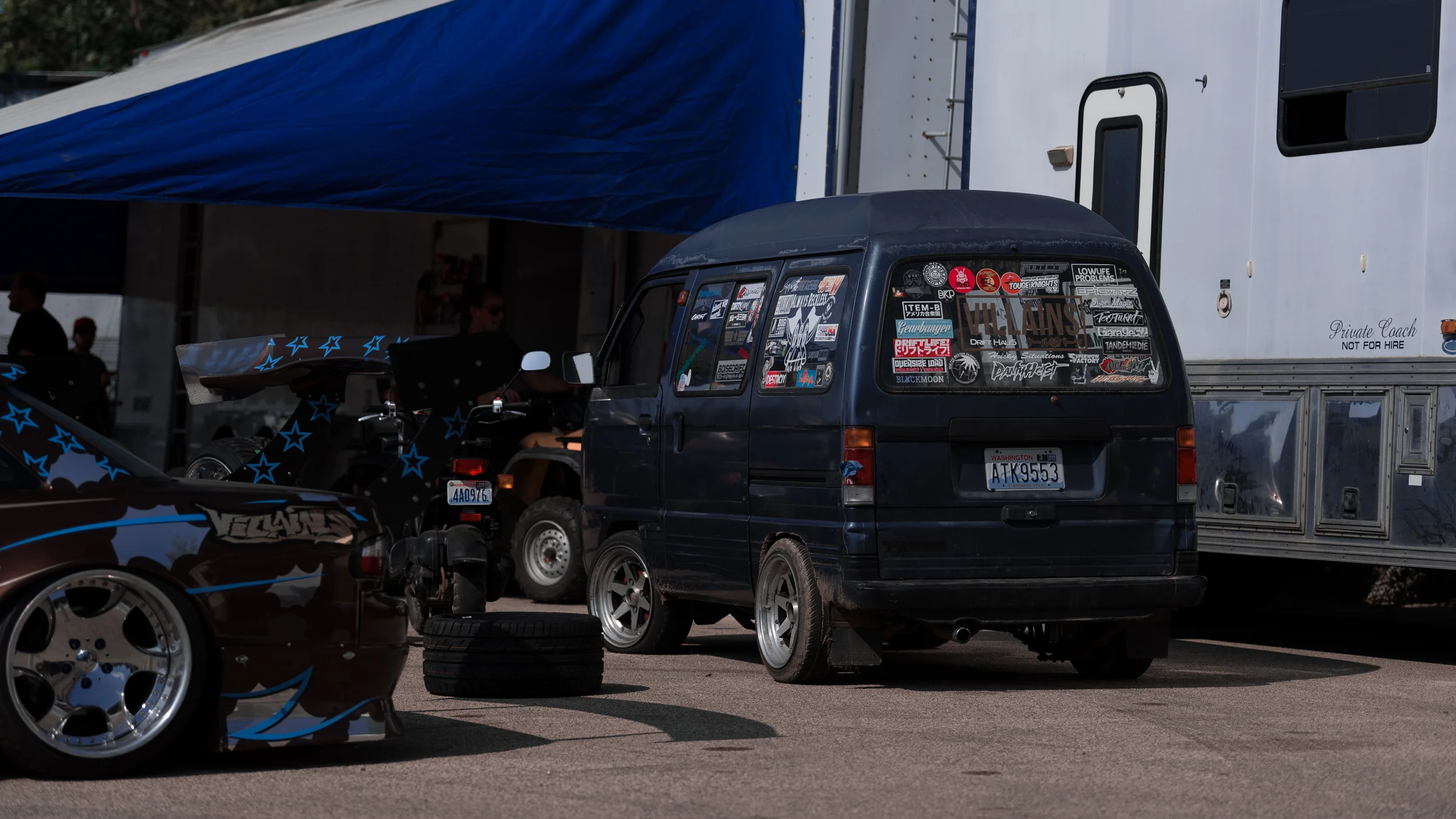 Villains unpacking their trailer and getting their extreme wide body D-machines ready.