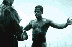 Guard with naked prisoner in the rain