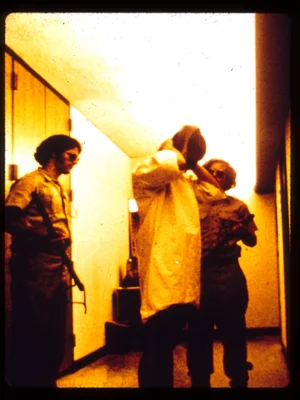 Prisoner covering hair with stocking cap