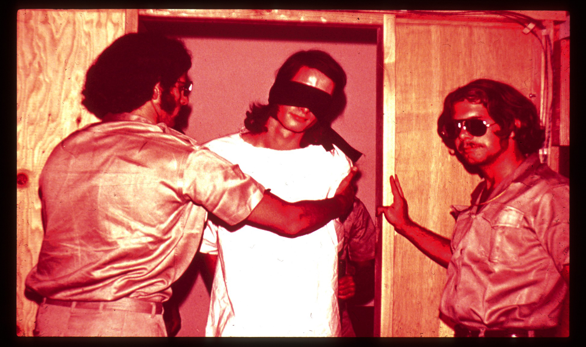 Guards with Blindfolded Prisoner