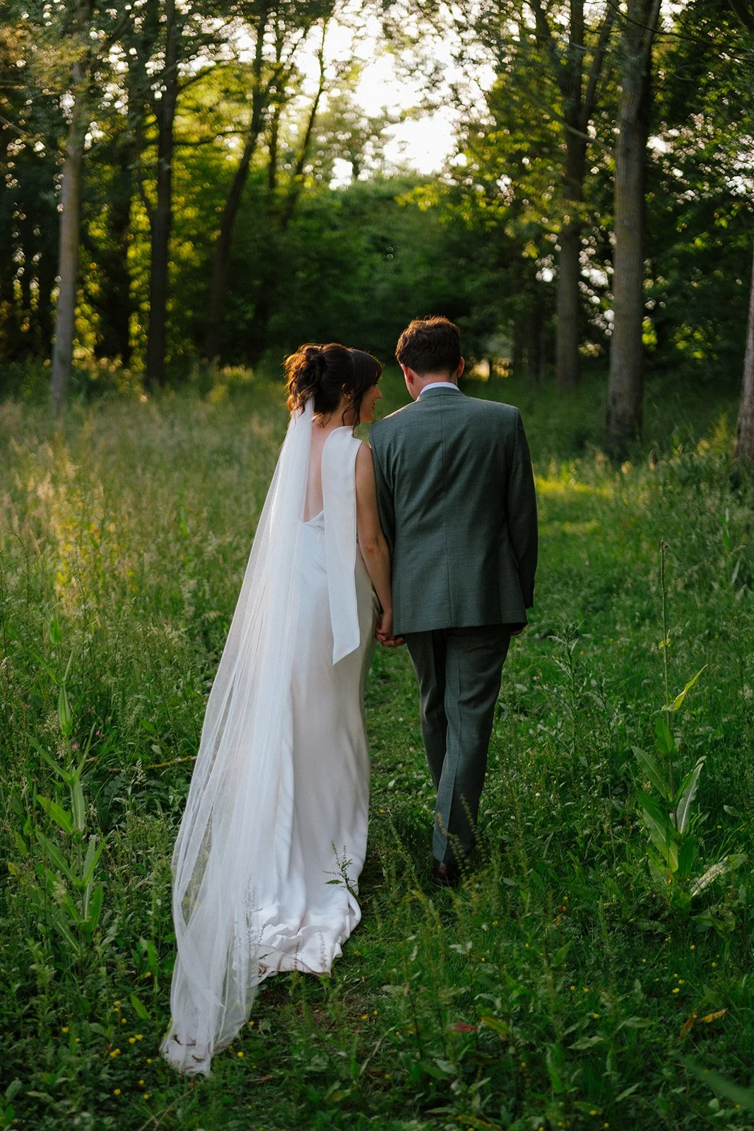 wedding couple walking at Essex wedding venue