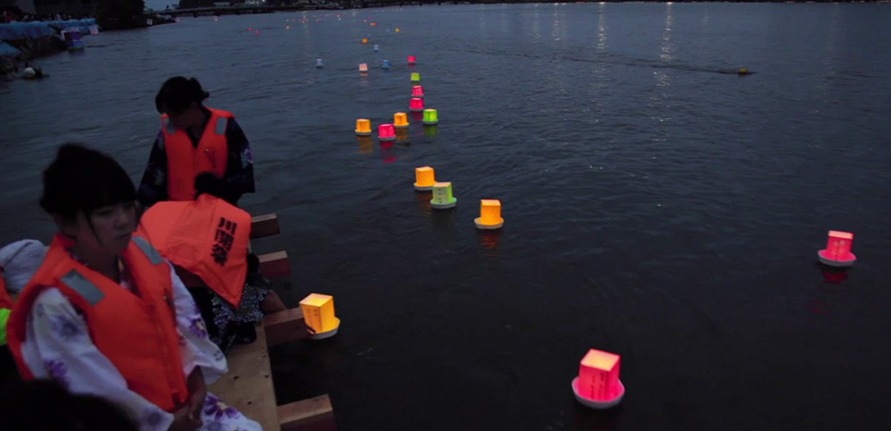 Touronagashi: floating lanterns in honor of ancestral spirits, an Obon tradition. Photo (c)2011 Stu Levy.