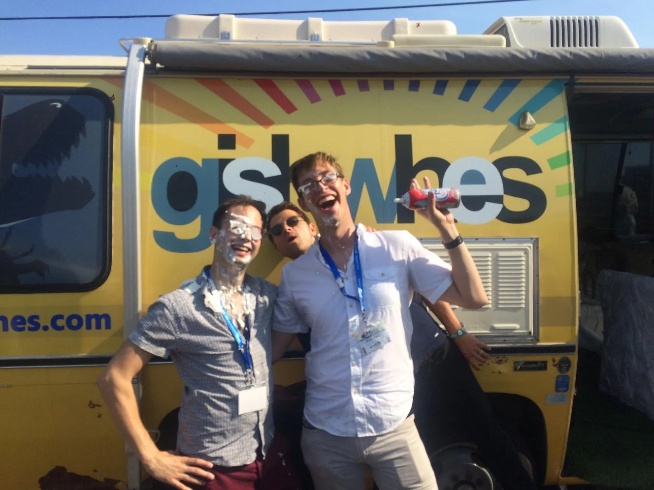 Outside the Gishbus, Random Acts volunteers show the aftermath of a whipped cream fight!
