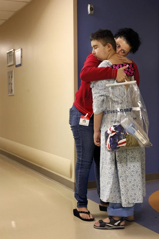 Maria Maldonado gives Ethan Arbelo, 12, one last hug before he heads for an MRI on November, 20, 2013 at All Children’s Hospital in St. Petersburg, Fla. The MRI will show that a tumor has taken over Ethan’s brain and cancer has spread into his spine