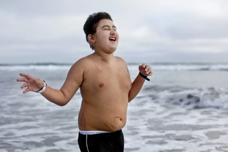 Ethan Arbelo, 11, runs along the beach an hour after leaving the hospital following an emergency related to his cancer on June 26, 2013, in Carlsbad, Calif. Diagnosed in March 2012 with anaplastic astrocytoma grade III, a terminal brain cancer, Ethan was prescribed with merely life-extending, not curative treatment. With the help of his mom, Maria Maldonado, he set out on a cross-country road trip to tackle a list of things he wanted to do. California was the halfway mark. 
