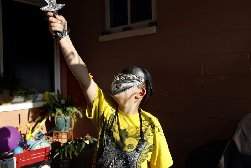 Ethan Arbelo, 11, plays in the backyard of a friend’s home who also has terminal cancer on April 10, 2013 in St. Petersburg, Fla. Ethan often found himself imagining superhero scenarios. “I like them so much because, just as someone is about to die,