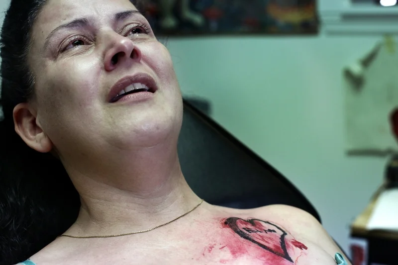 On July 5, 2014, two days after Ethan Arbelo died, Maria Maldonado receives a tattoo at Ink Cafe in Cape Coral, Fla, of a drawing Ethan made with their initials just before losing movement in his hands. “This way he is always with me,” Maria said.&n