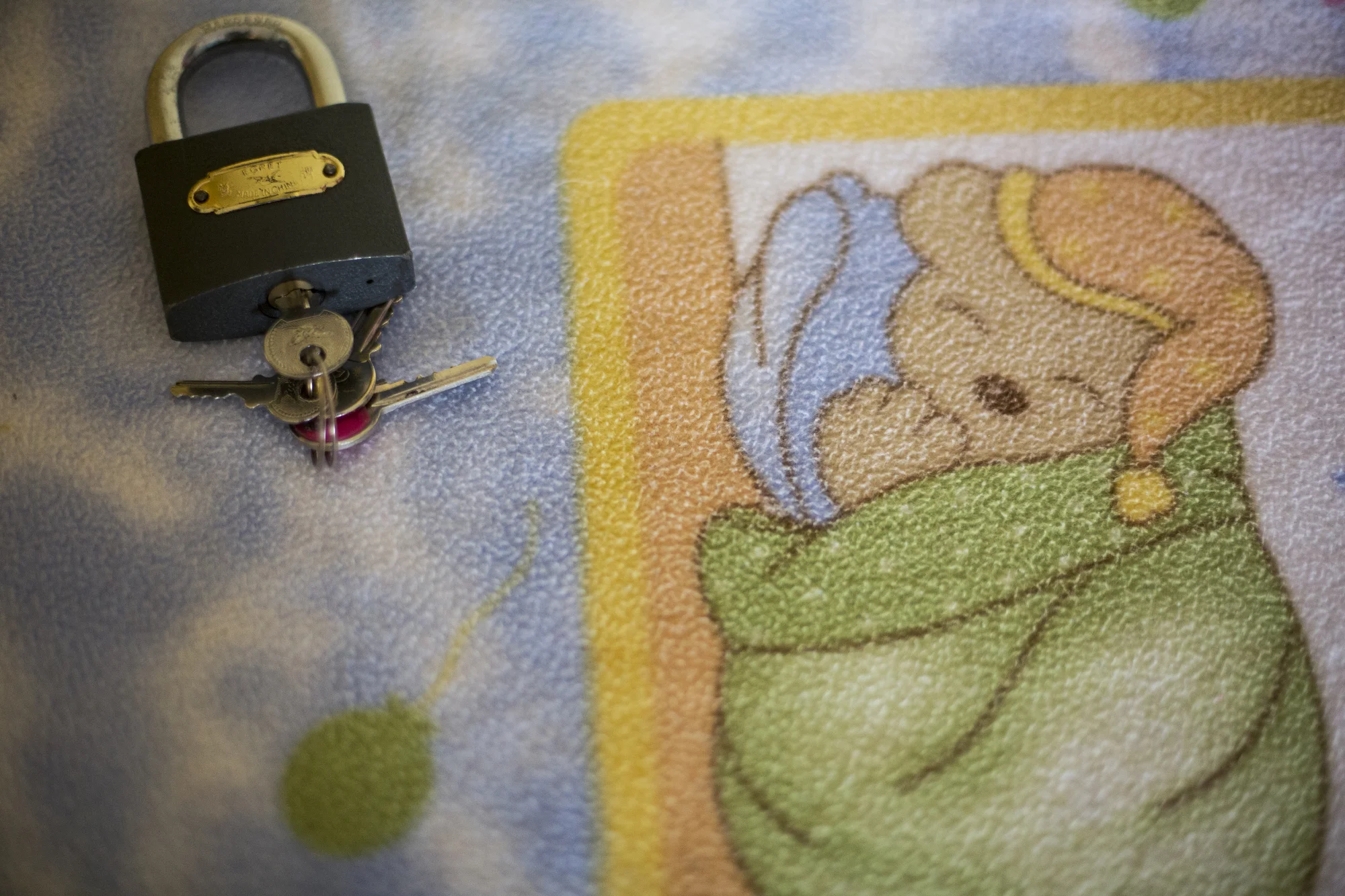 A lock Maria Del Mar Toledo uses for her front door sits on a desk in her one-bedroom apartment in Bogotá, Colombia on September 21, 2016. Toledo lives in Ciudad Bolivar, one of the most dangerous areas of Colombia's capital city of Bogotá. 