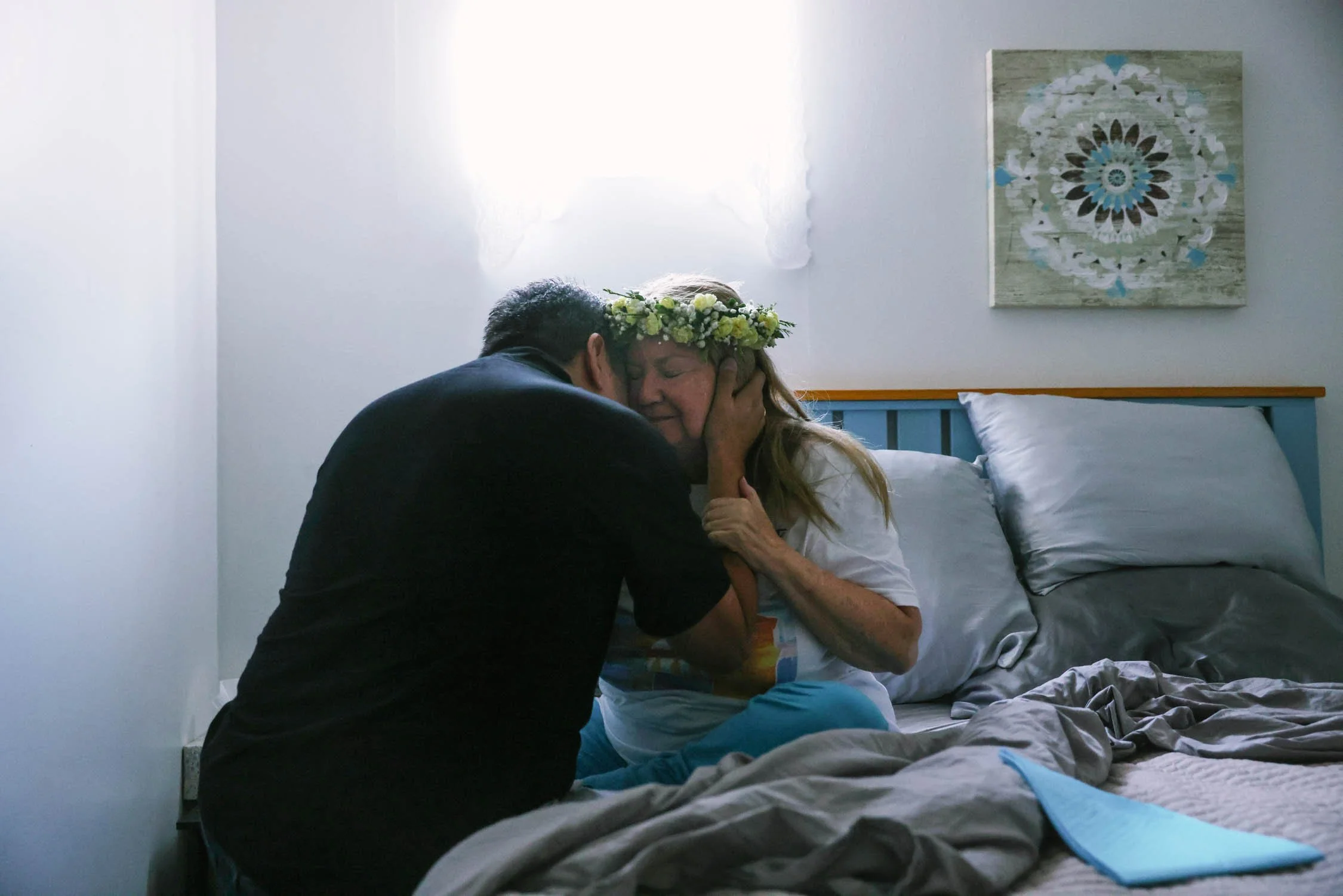 Rudy Sanzana, a friend of more than 30 years hugs Gabriella one last time before she dies through medical aid on July 16, 2022 in Santa Paula, CA. When Gabriella was diagnosed with terminal cancer she did not consider life extending treatments but r