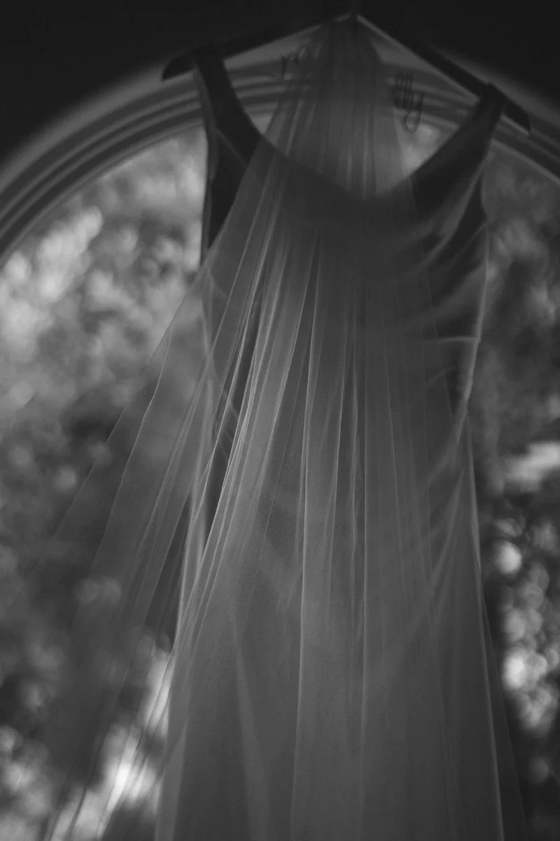 A bridal dress hangs in Malibu before the wedding day. I am a Los Angeles and Santa Barbara wedding photographer. 