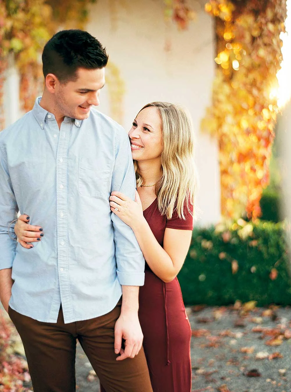 Couple smiling during engagement session.