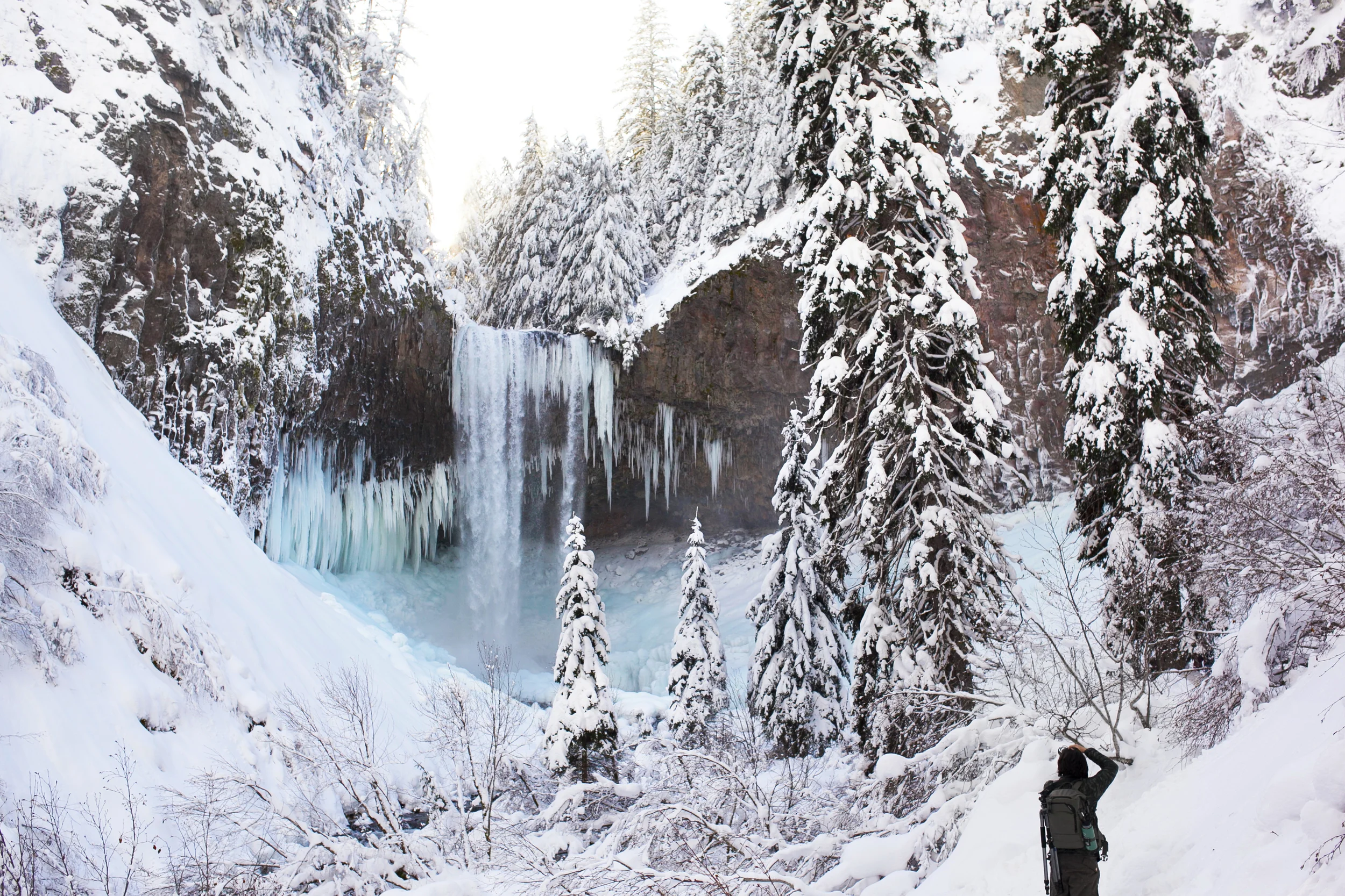 Derek Gaumer photographing the beautiful frozen Tamanawas Falls