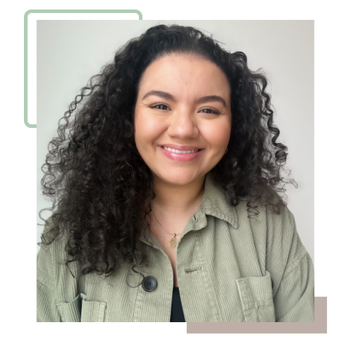 Reem, a self-described person of colour and second-generation immigrant, is smiling. Reem has brown, curly hair, and is wearing an open light green collared shirt with a black shirt underneath.
