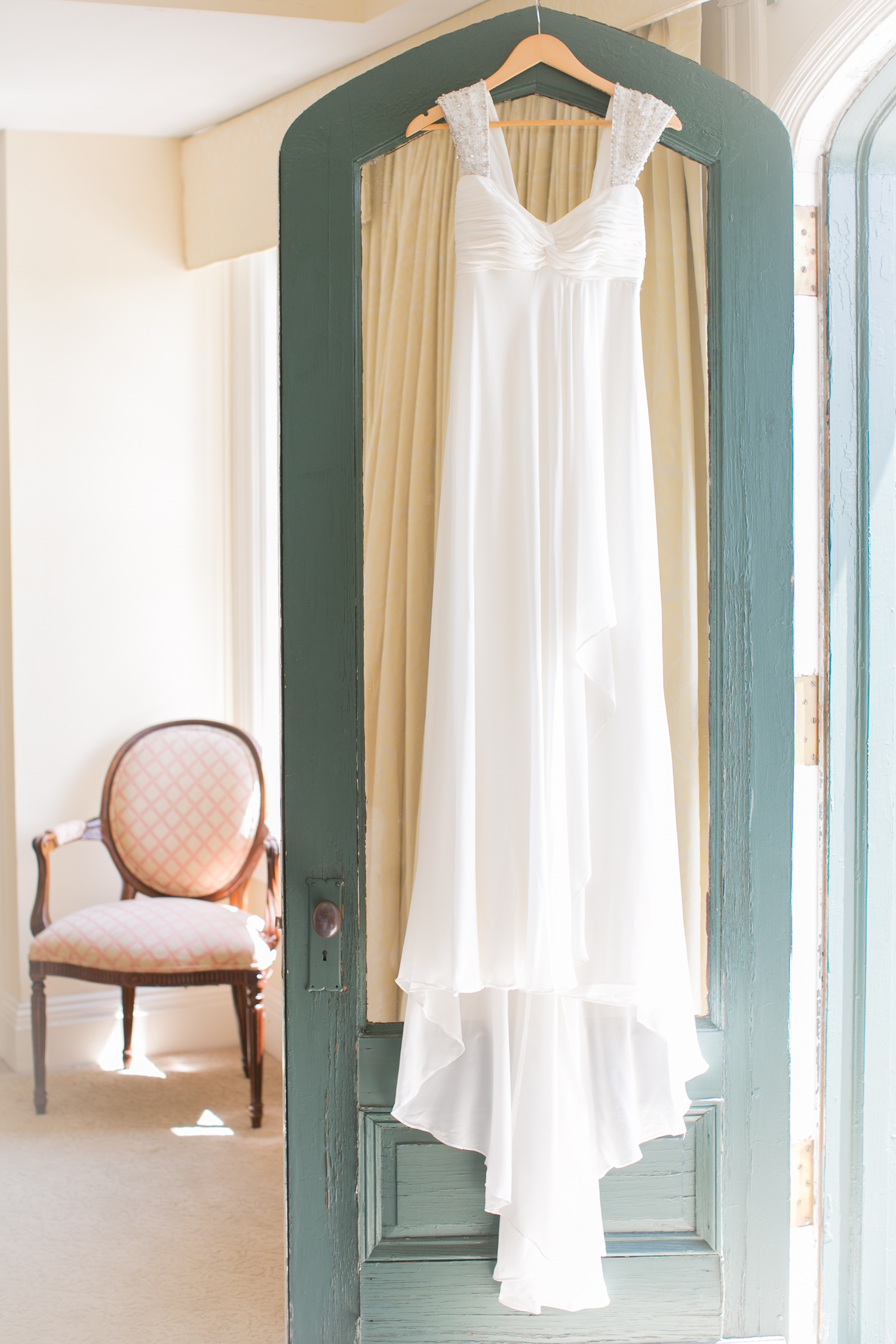  The bride's dress hanging in her dressing room 