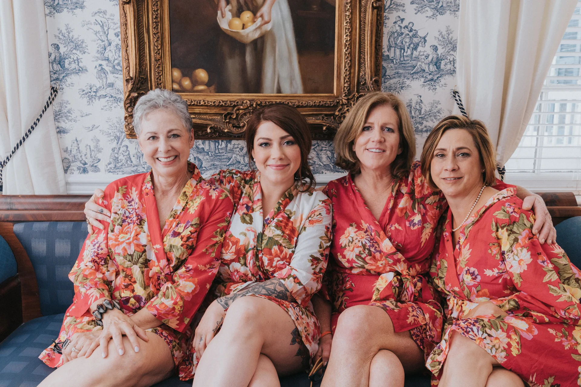Bridesmaids and family members getting ready before the wedding with the bride