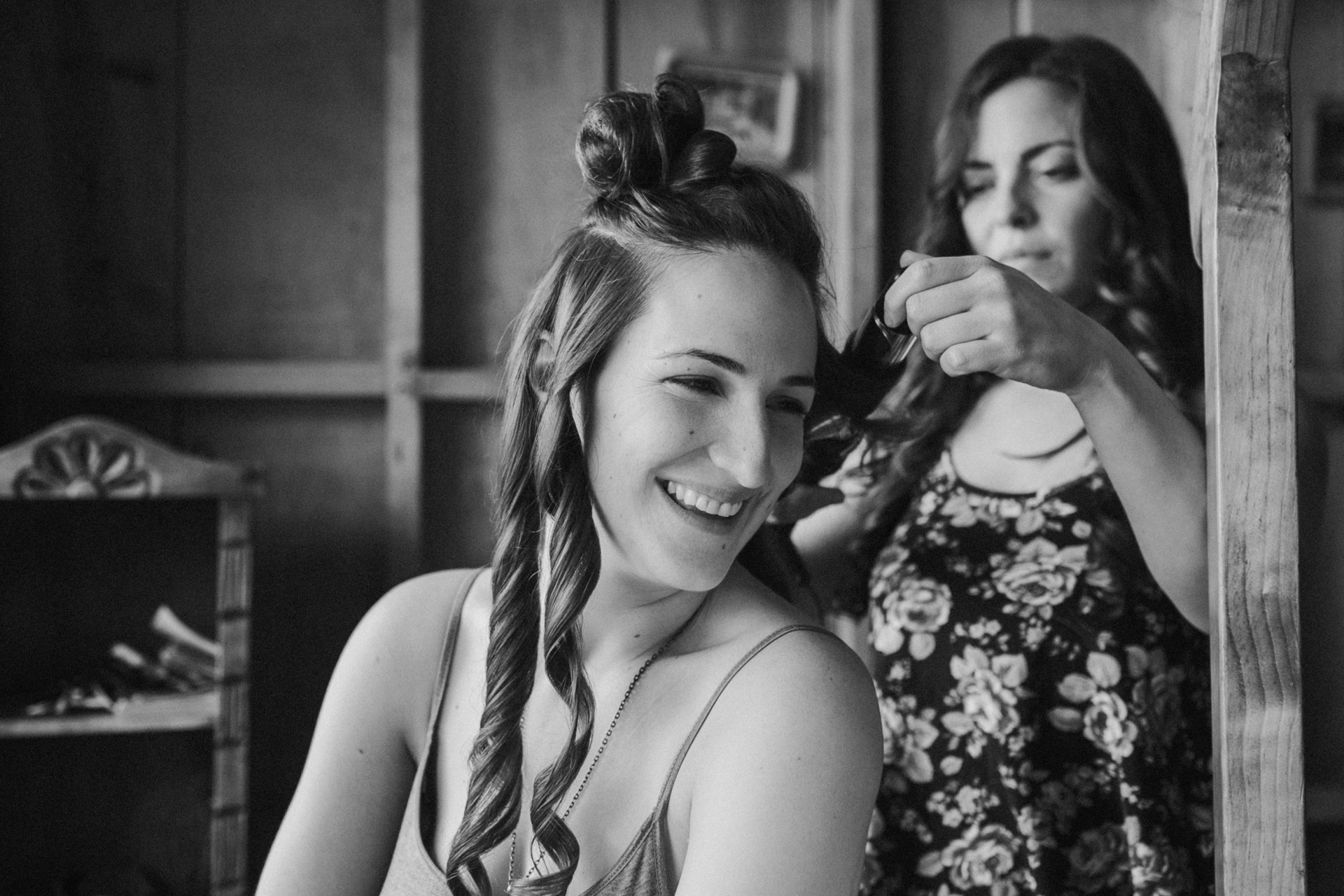  The bride to be getting her hair and makeup done before the wedding 