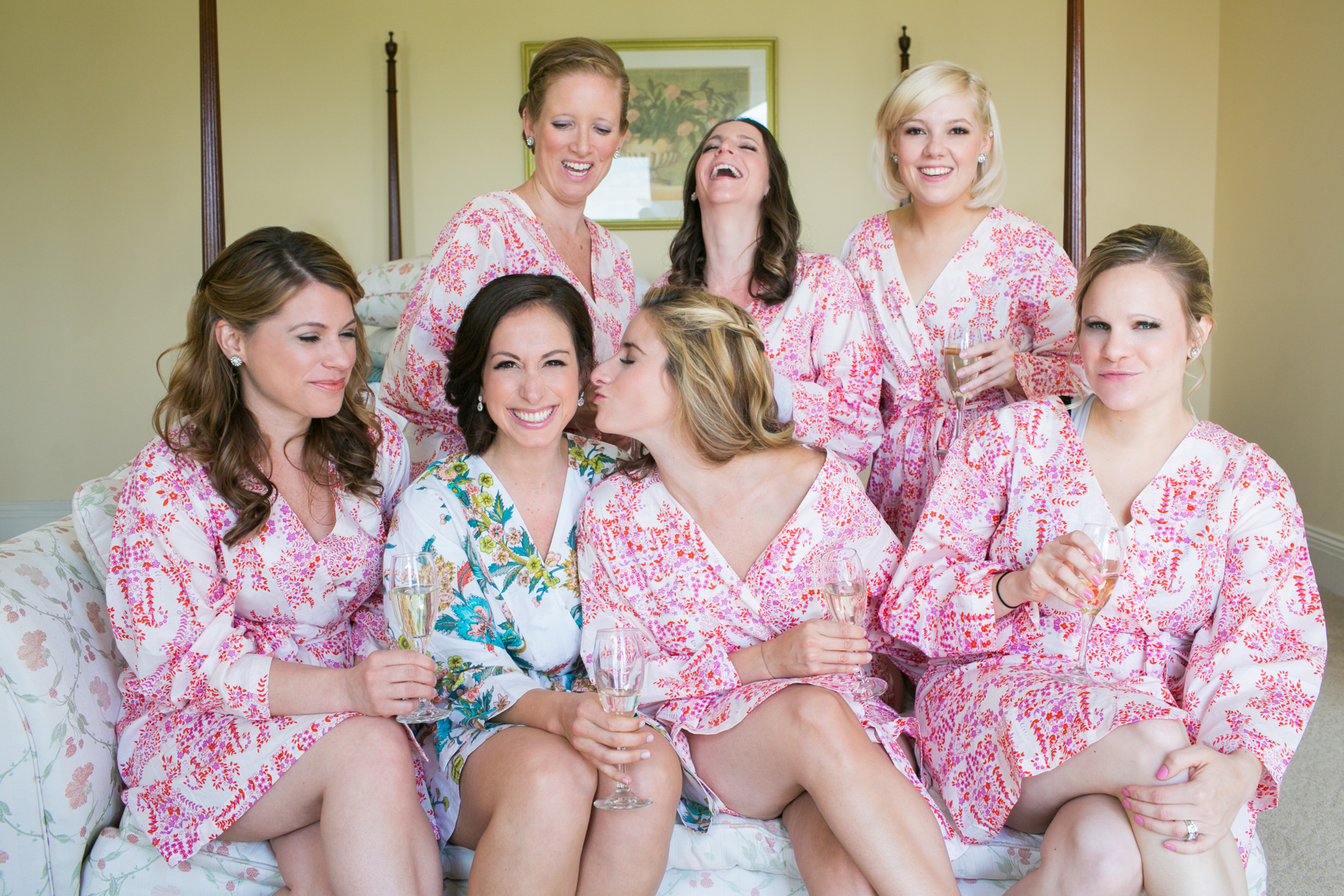  The bride and her bridesmaids all celebrating and getting ready for the wedding 