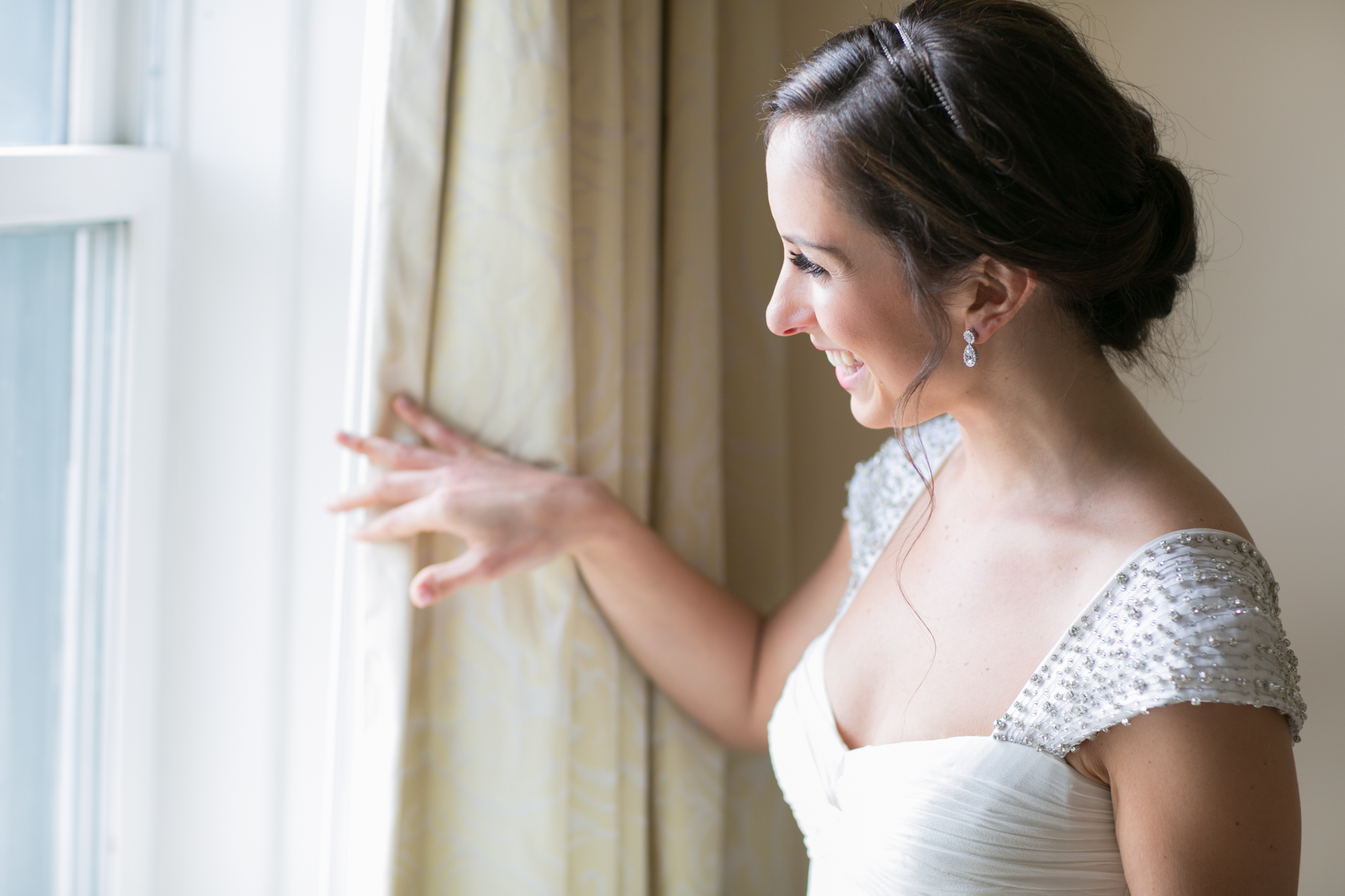  The bride looking outside her window to see her groom 