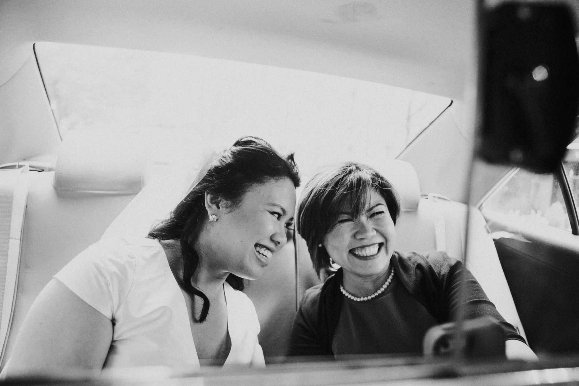 The mother of the bride and the bride in a taxi on their way to the ceremony