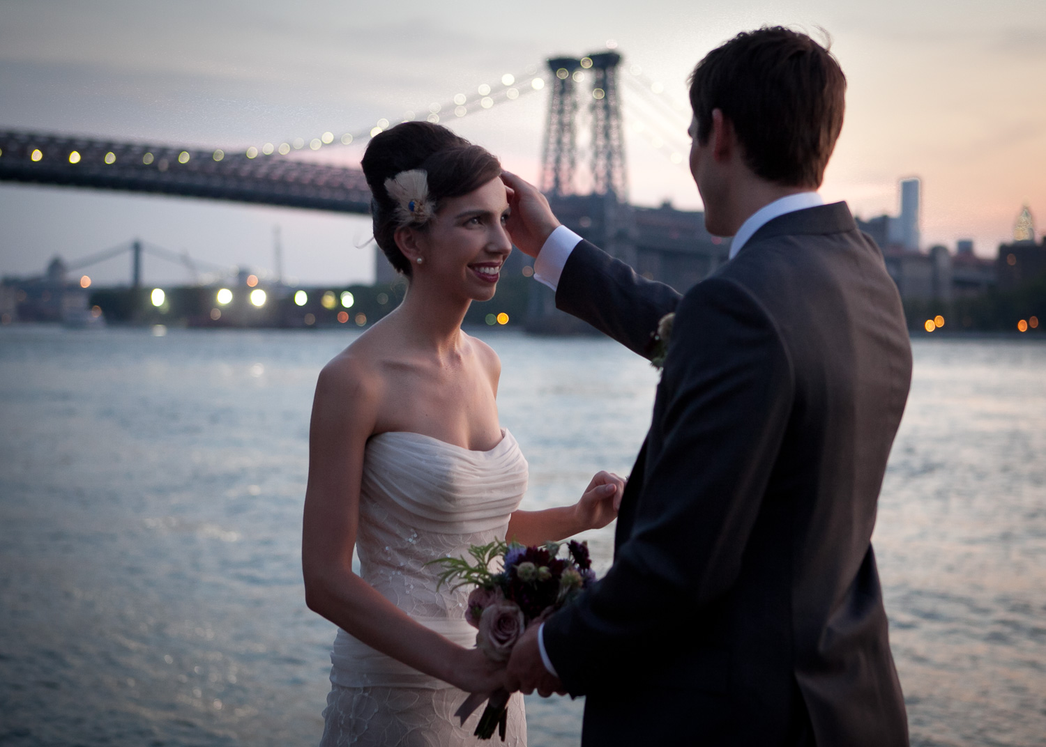  The bride and groom upon first seeing each other before the ceremony, during sunset on the Hudson NYC 