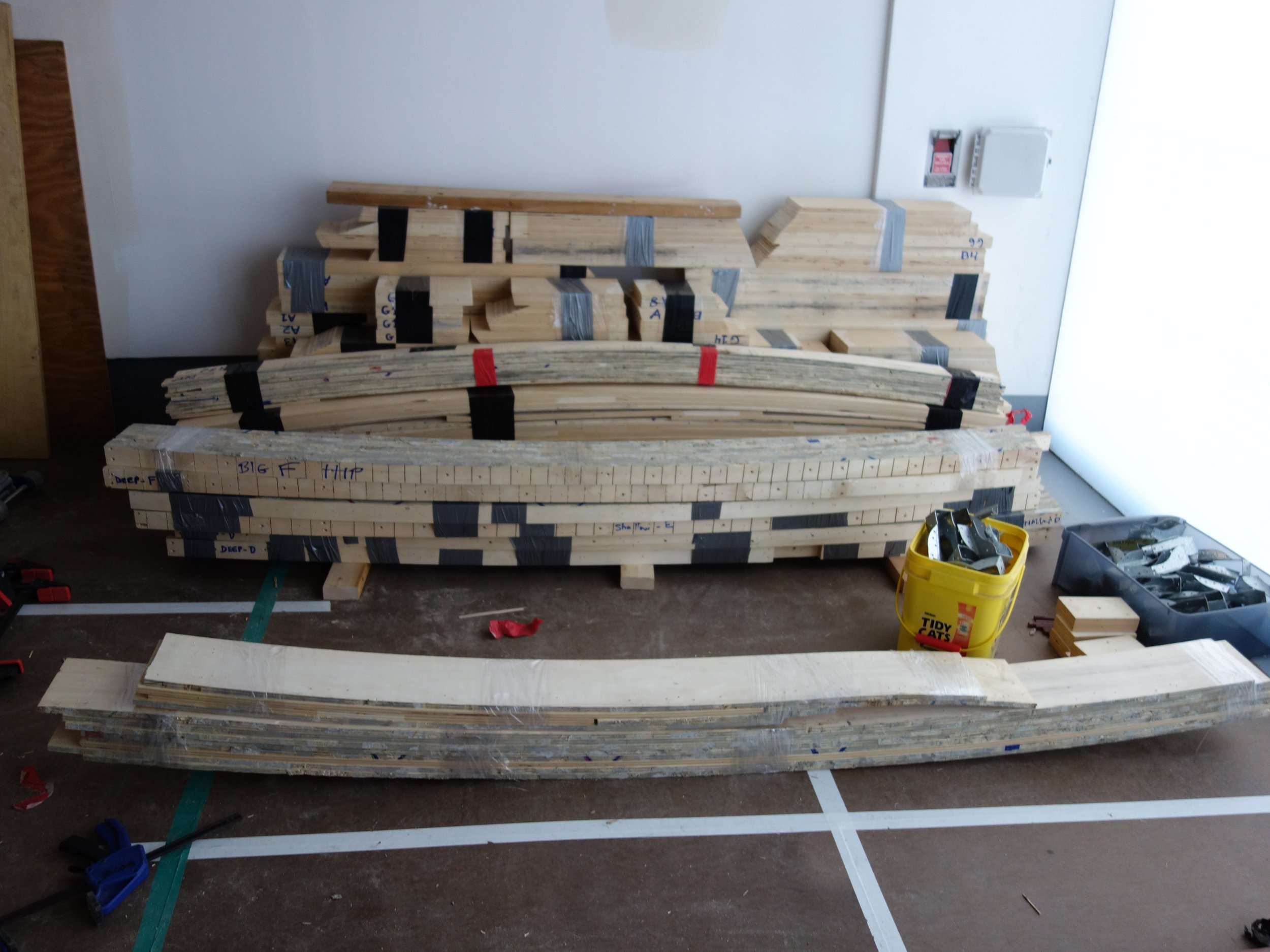  Here are the bundles of ply which will form the deck joists and the spandrel, which is the curved beam that will surround the perimeter of the bowl. 