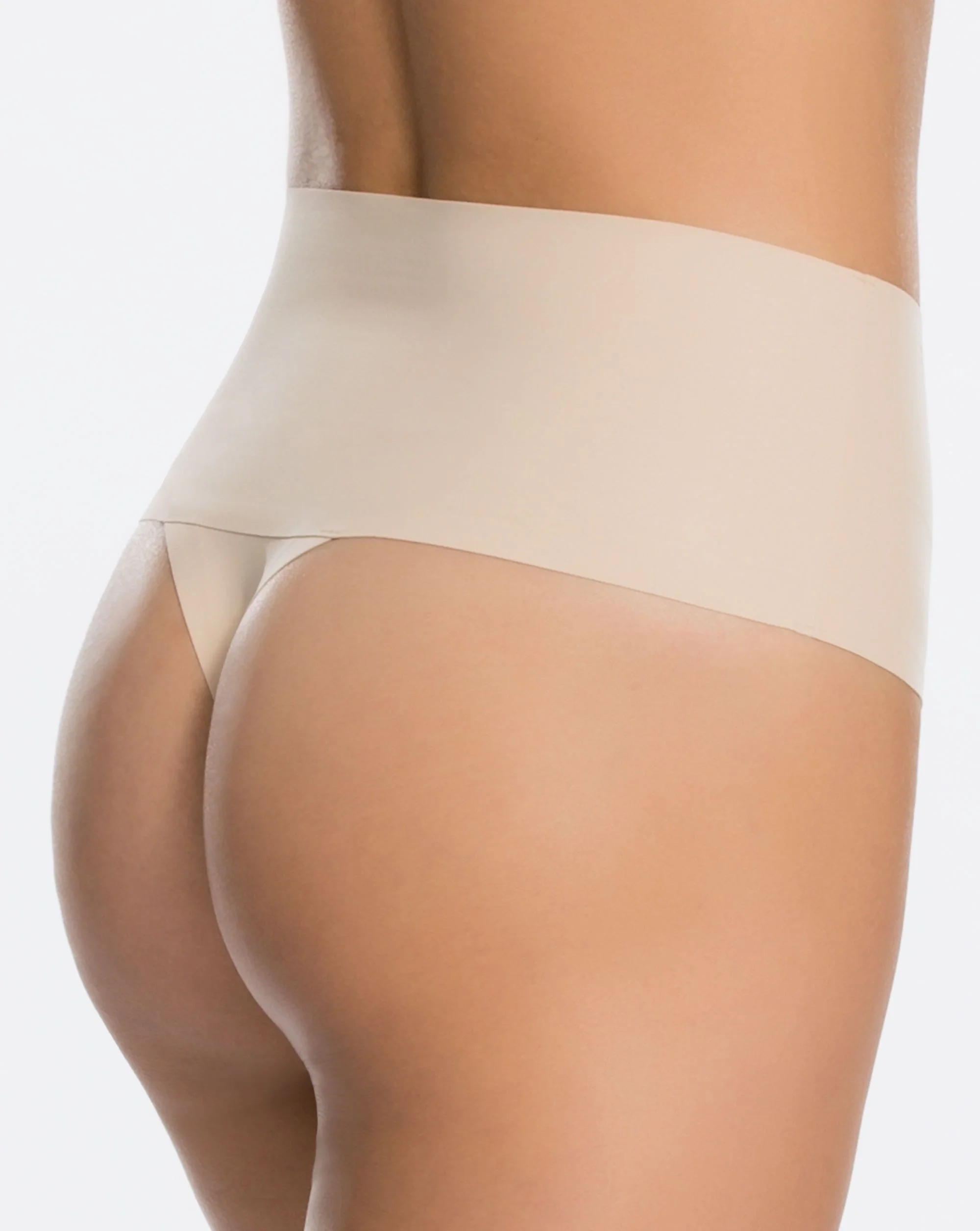 Undie-tectable Thong    VPL no more! These elastic-free edges and a bonded waistband make these next-to-nothing panties truly ‘undie-tectable’.  These are a game changer. The perfect underwear under any fitted dress that has a high split or low back.  We recommend this thong for the Arlia and Arielle Gowns.  Find these on the Spanx website  here