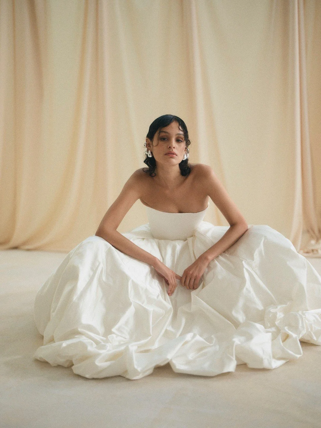 DELPHINE | Highlighting the Delphine collection from our STUDIO collection 02. Delphine is a modern love note to our fashion forward brides wanting something modern and bold yet minimal and refined.

Made from 12 meters of our rich ivory toned silk d