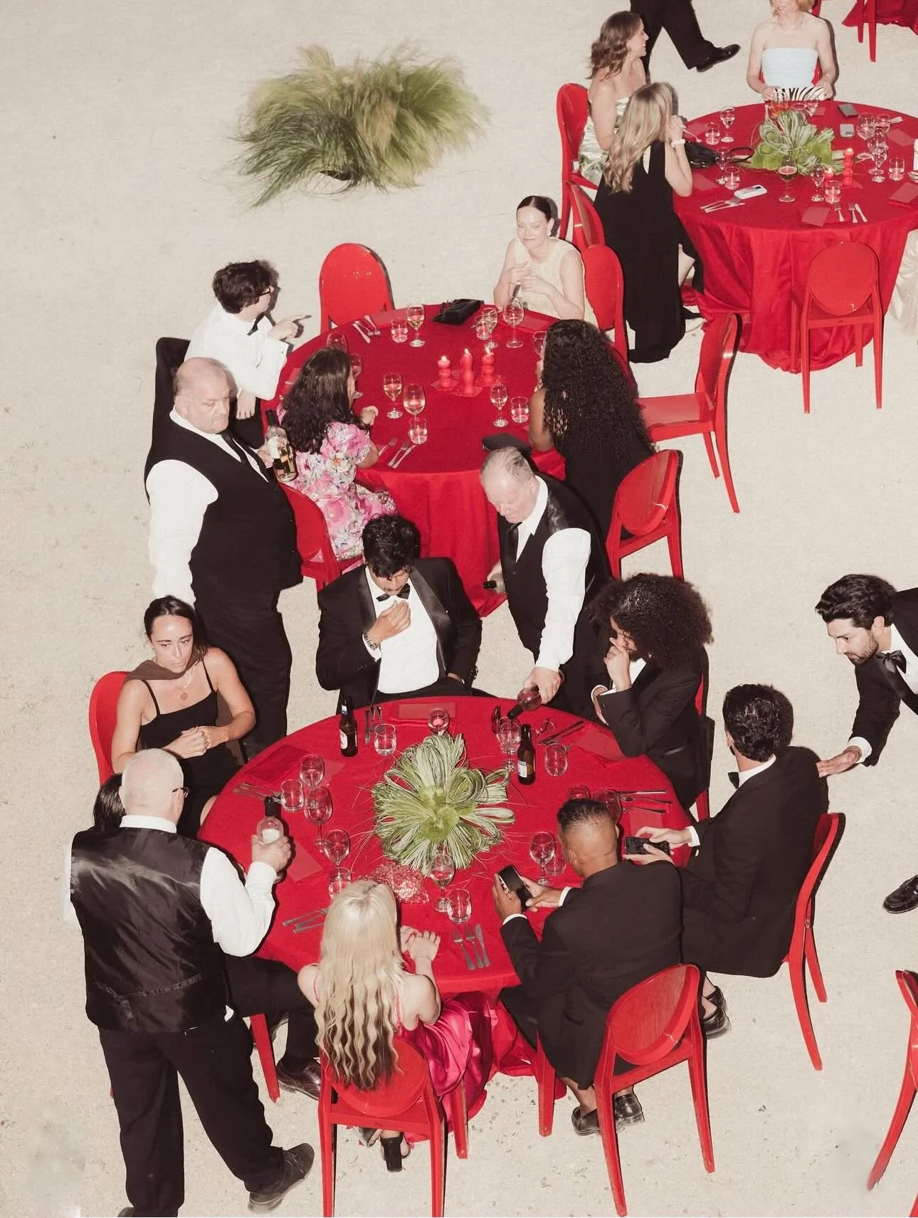 REAL BRIDE | Maddy + Nat ❤️&zwj;🔥 

Maddy wears the Gianna Dress with the Grace Overskirt &mdash; effortless, sculptural and timeless. 
Confident design choices set the tone.
Bold red tables, candlelight and a vintage aesthetic create a striking, ci