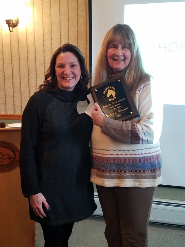 Board member Gloria Bruce presents Horse Person of the Year award to Becky Williams of Horses Home Again