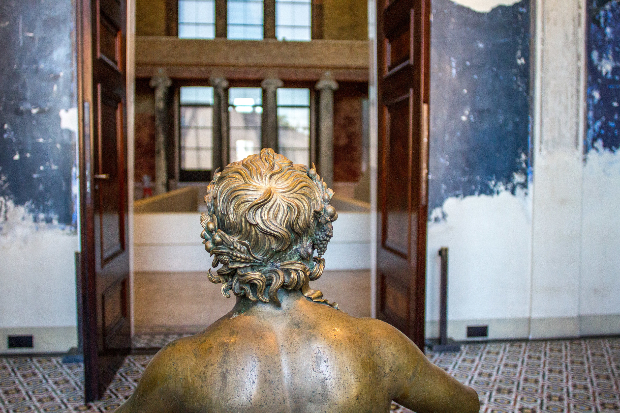 View through to the contemporary staircase in the Grand Hall. Image by John Dawson