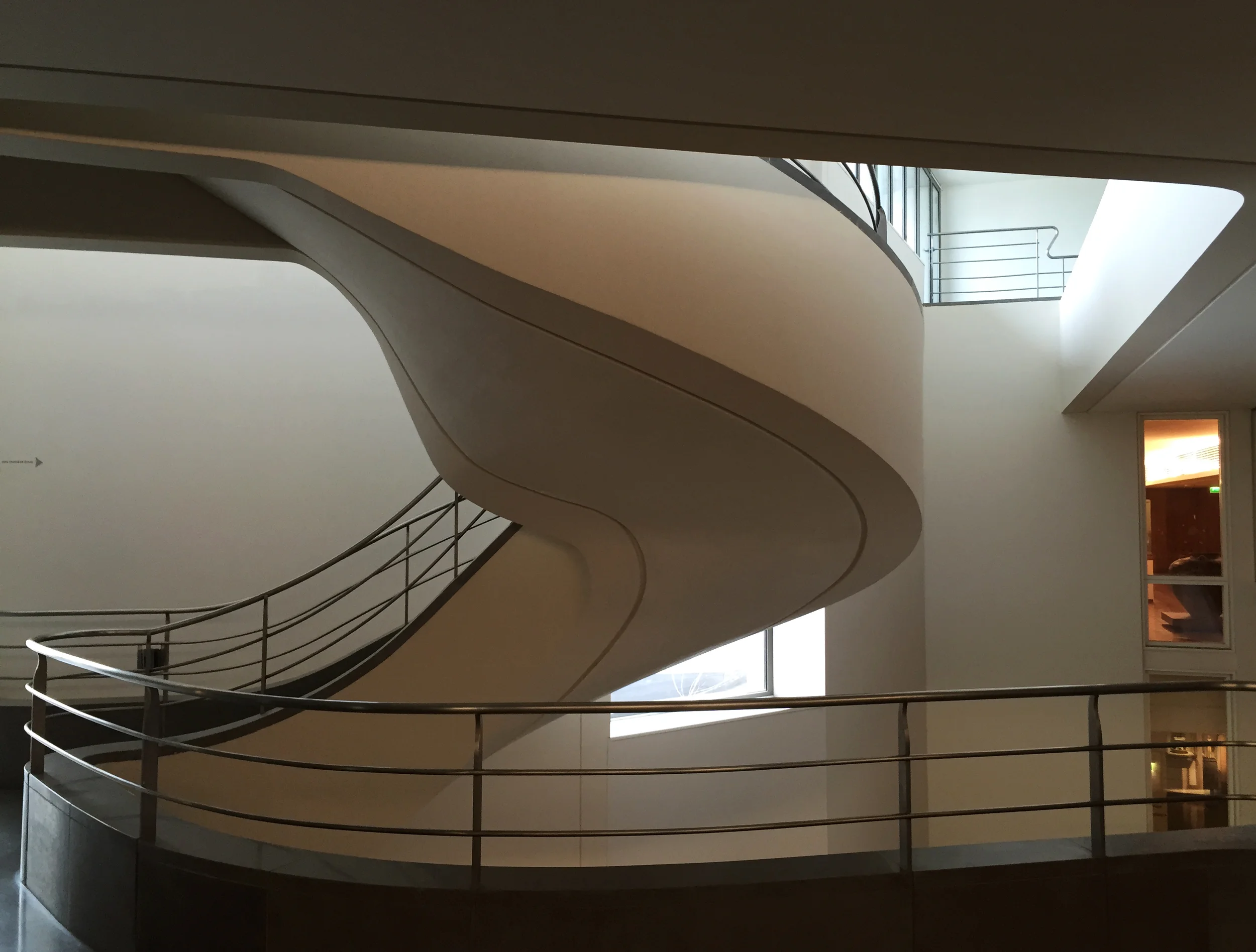 A sweeping stair at the Museum of Asian Art in Paris creates a sense of great occasion. The curving structure offers views down into the grand hall and into the beautifully-sequenced exhibition spaces on the upper levels.